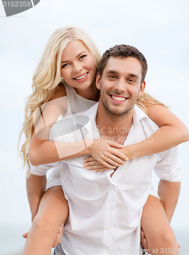 Image of couple having fun on the beach