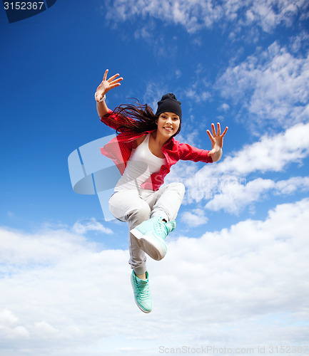 Image of beautiful dancing girl jumping