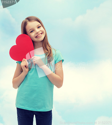 Image of smiling little girl with red heart