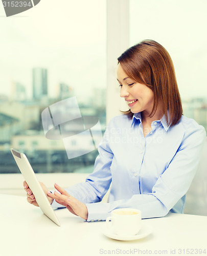 Image of smiling businesswoman with tablet pc and coffee