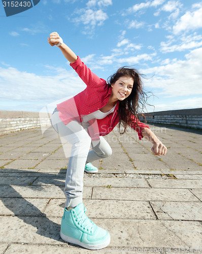 Image of beautiful dancing girl in movement