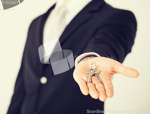 Image of man holding house keys