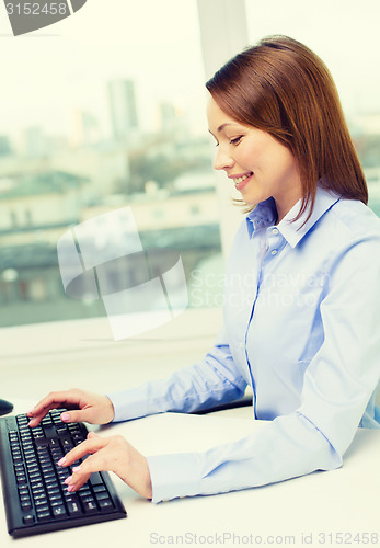 Image of smiling businesswoman or student with computer