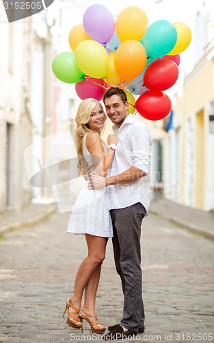 Image of couple with colorful balloons