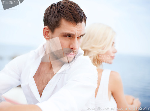 Image of stressed man with woman outside