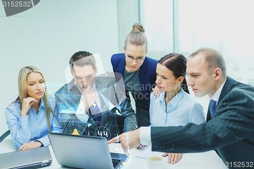 Image of business team with laptop having discussion