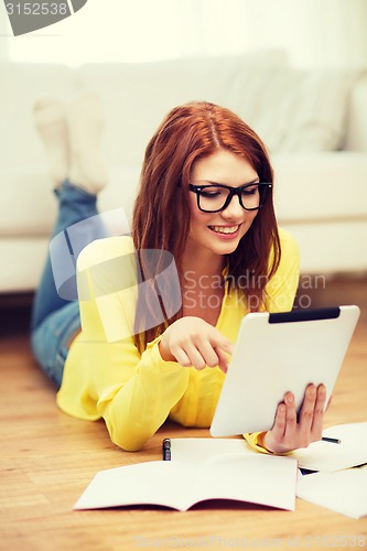 Image of student with tablet pc computer and notebooks