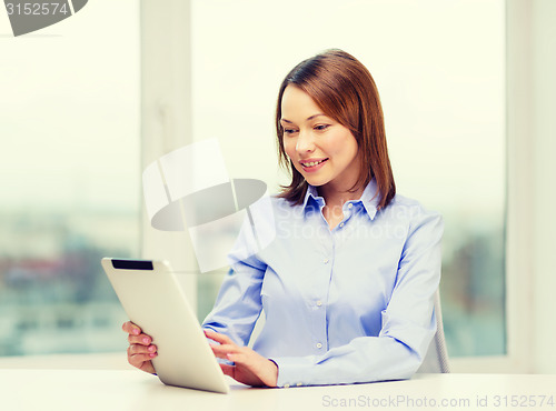 Image of smiling businesswoman or student with tablet pc