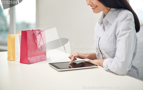 Image of close up of woman with tablet pc at office