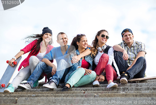 Image of teenagers with skates outside