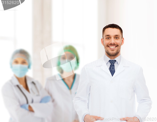 Image of smiling male doctor in white coat