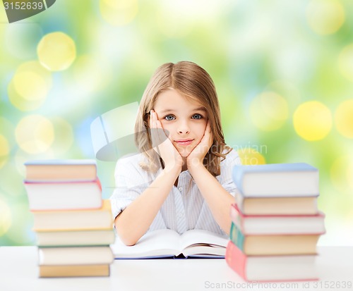 Image of happy student girl with books at school