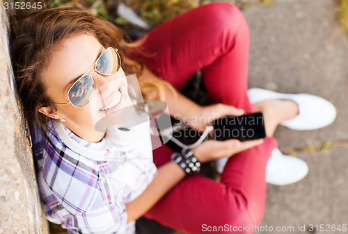 Image of girl with headphones listening to music