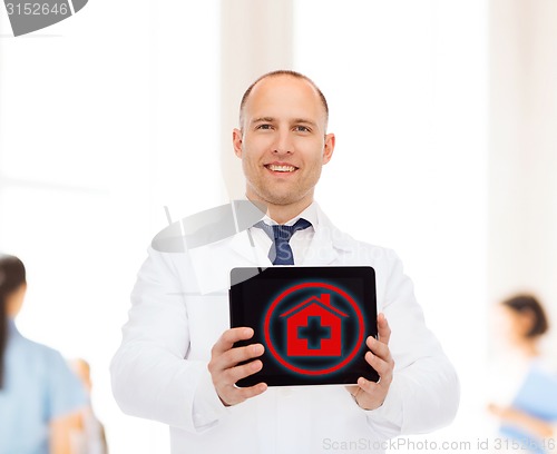 Image of smiling male doctor with tablet pc