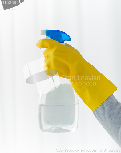 Image of close up of hand with cleanser spraying