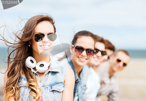 Image of teenage girl with friends outside