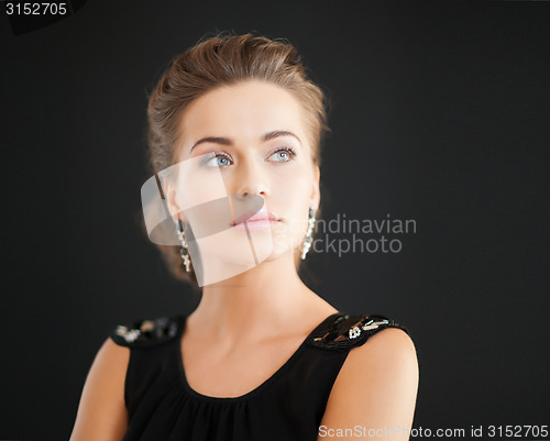 Image of woman with diamond earrings