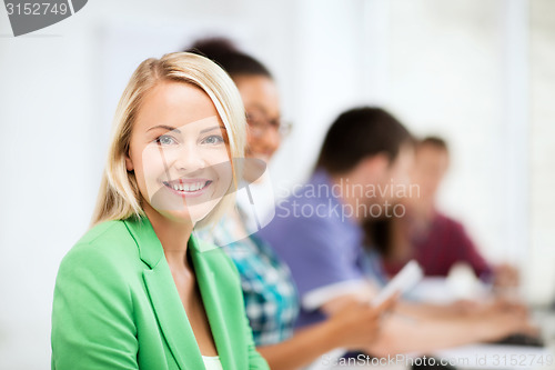 Image of students with computers studying at school