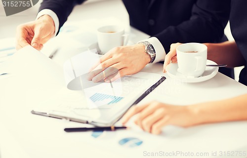 Image of woman hand signing contract paper