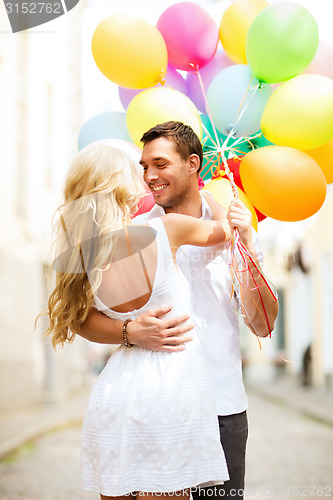 Image of couple with colorful balloons