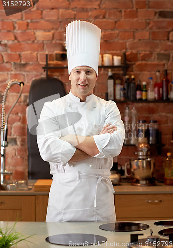 Image of happy male chef cook in restaurant kitchen