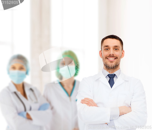 Image of smiling male doctor in white coat