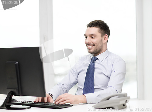 Image of smiling businessman or student with computer