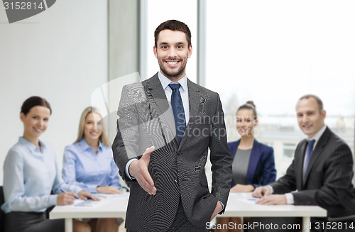 Image of businessman with open hand ready for handshake