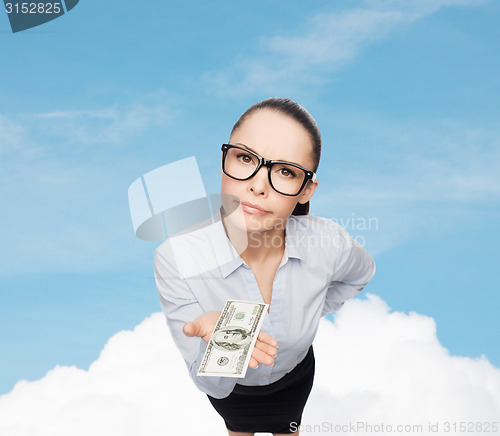 Image of smiling businesswoman with dollar cash money