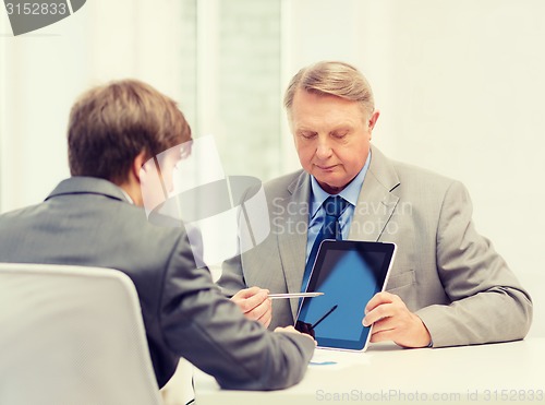 Image of older man and young man with tablet pc