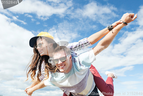 Image of teenagers having fun outside