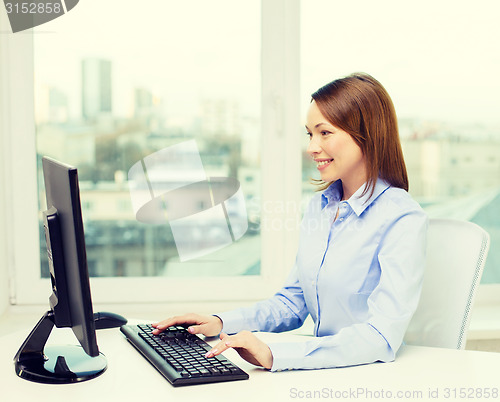 Image of smiling businesswoman or student with computer