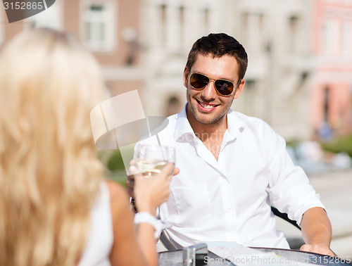 Image of couple drinking wine in cafe