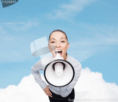 Image of screaming businesswoman with megaphone