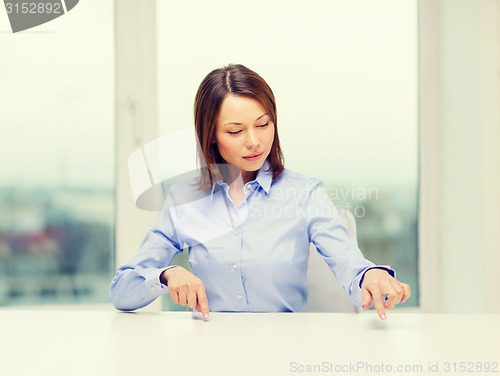 Image of smiling woman pointing to something imaginary