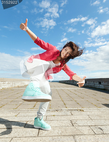 Image of beautiful dancing girl in movement