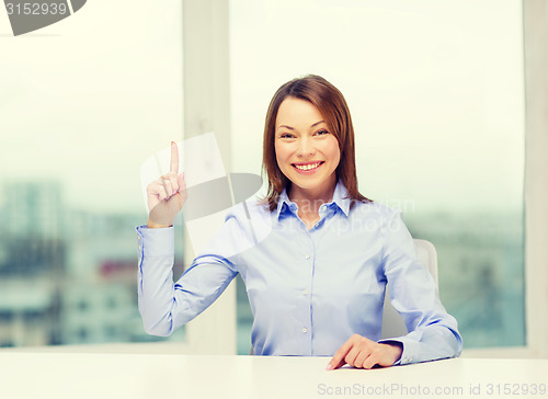 Image of attractive businesswoman at office