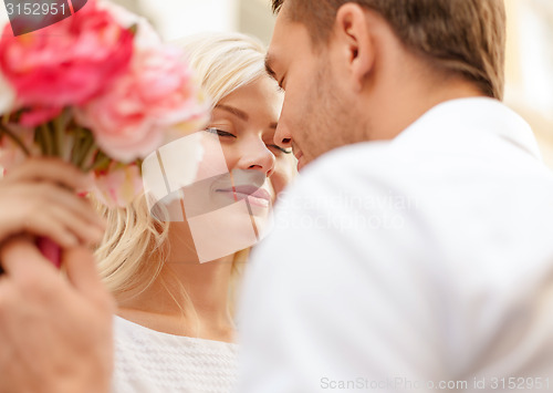 Image of couple with flowers in the city