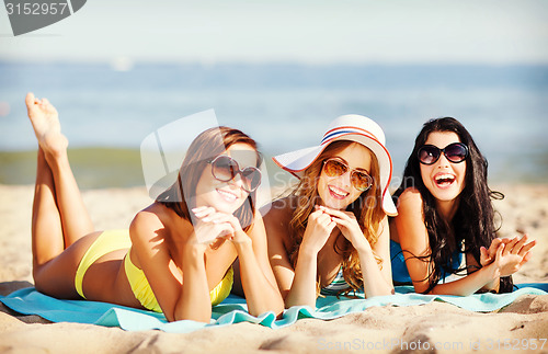 Image of girls sunbathing on the beach