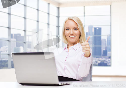 Image of smiling businesswoman or student with laptop