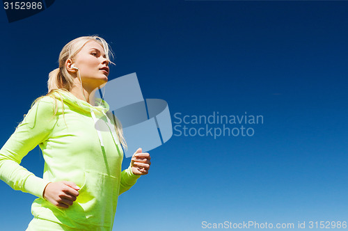 Image of woman doing running outdoors