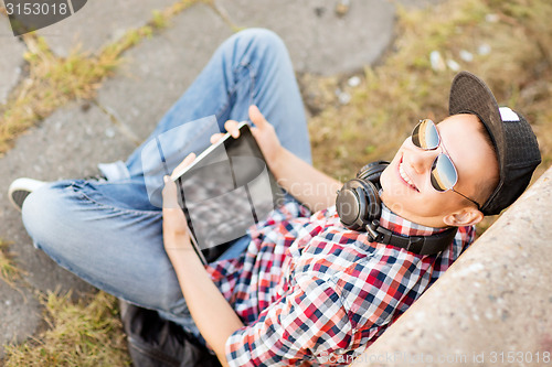 Image of girl with headphones and tablet pc