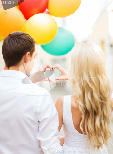 Image of couple with colorful balloons