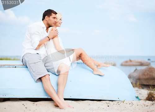 Image of couple in shades at sea side