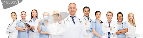 Image of group of smiling doctors with showing thumbs up