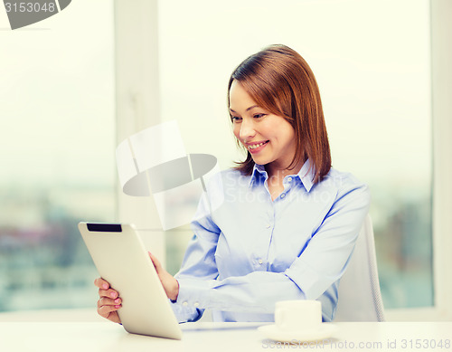 Image of smiling businesswoman or student with tablet pc