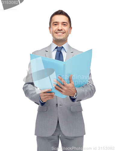 Image of happy businessman with open folder