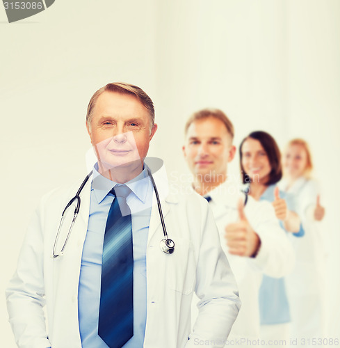 Image of smiling doctor or professor with stethoscope