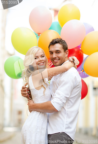 Image of couple with colorful balloons