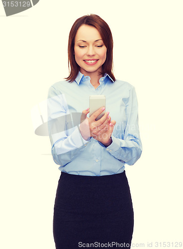 Image of young smiling businesswoman with smartphone
